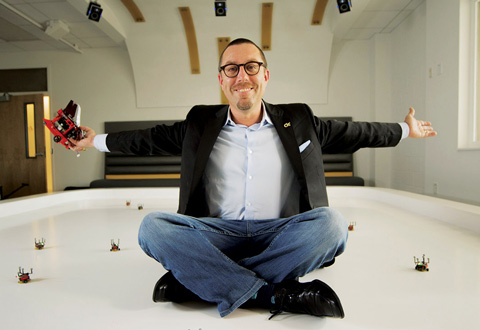Photo of man in the Robotarium with arms stretched out